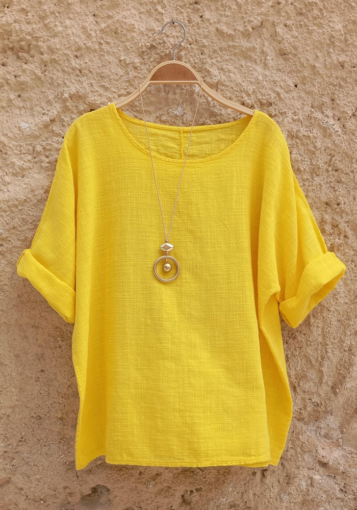 Oversized κίτρινη μπλούζα με στρογγυλή λαιμόκοψη και μανίκια με ρεβέρ
